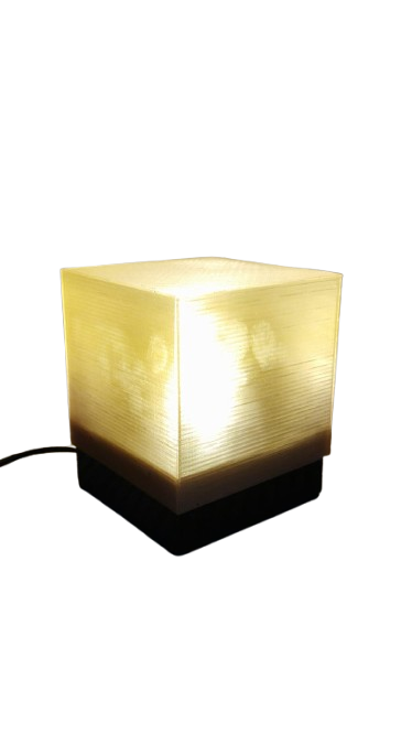 Modern decorative cube LED table lamp emitting blue ambient night light Cube LED night lamp for bedroom with energy efficient soft glow Decorative cube shaped LED lamp for living room and bedside use Minimalist cube LED lamp for home décor and ambient lighting Blue cube LED table lamp creating relaxing mood lighting indoors